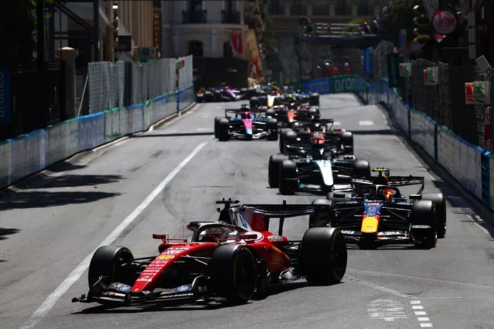 Charles Leclerc, Ferrari; Isack Hadjar, Red Bull Racing