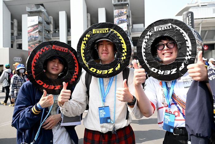 Fans dressed as Pirelli tyres in the fan zone.