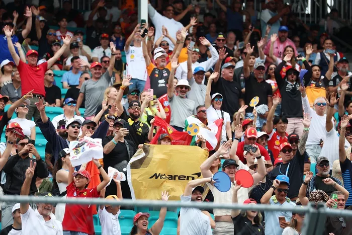Fans of McLaren in a grandstand.
