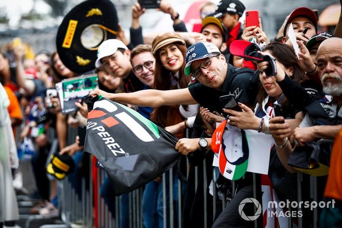 Fan of Sergio Perez, Racing Point waiting with a flag