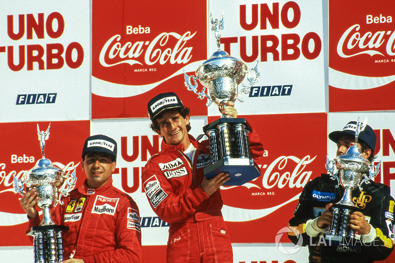 Podium: race winner Alain Prost, McLaren, second placed Michele Alboreto, Ferrari, third placed Elio De Angelis, Lotus