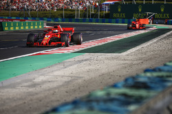 Sebastian Vettel, Ferrari SF71H, leads Kimi Raikkonen, Ferrari SF71H
