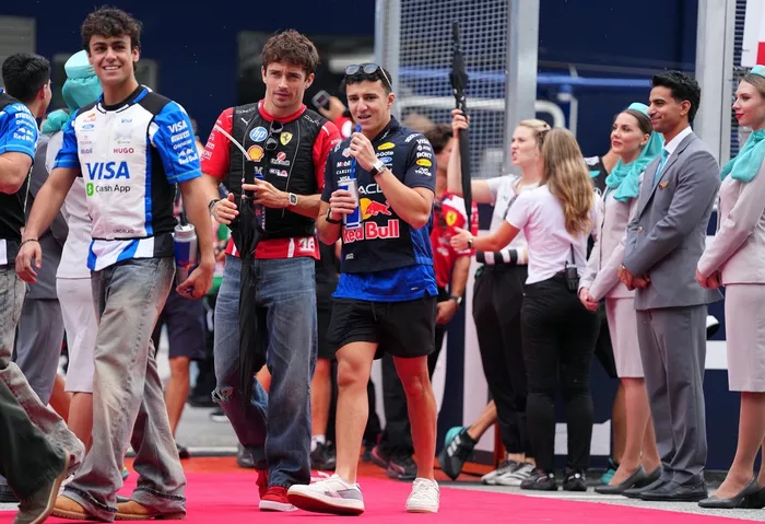 Charles Leclerc, Ferrari, Arvid Lindblad, Racing Bulls, Isack Hadjar, Red Bull Racing