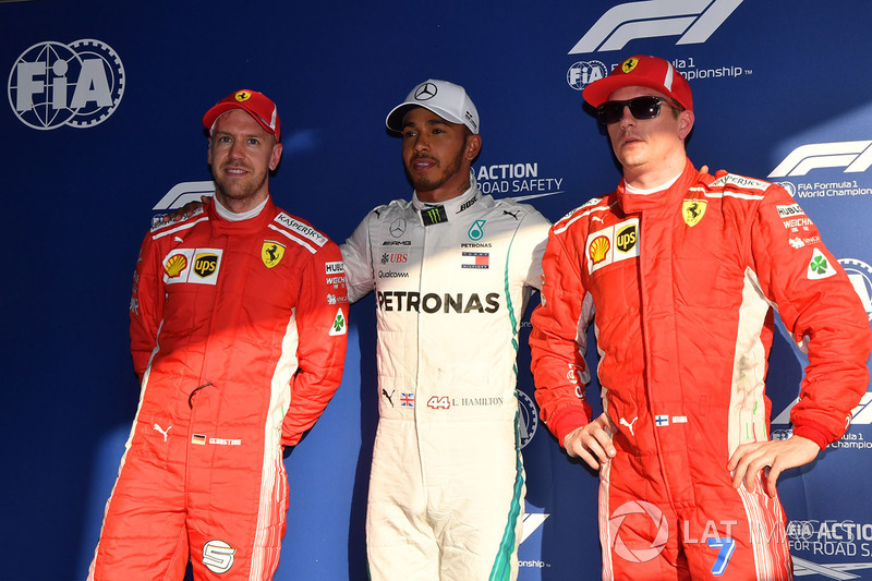 Sebastian Vettel, Ferrari, pole sitter Lewis Hamilton, Mercedes-AMG F1 and Kimi Raikkonen, Ferrari in parc ferme