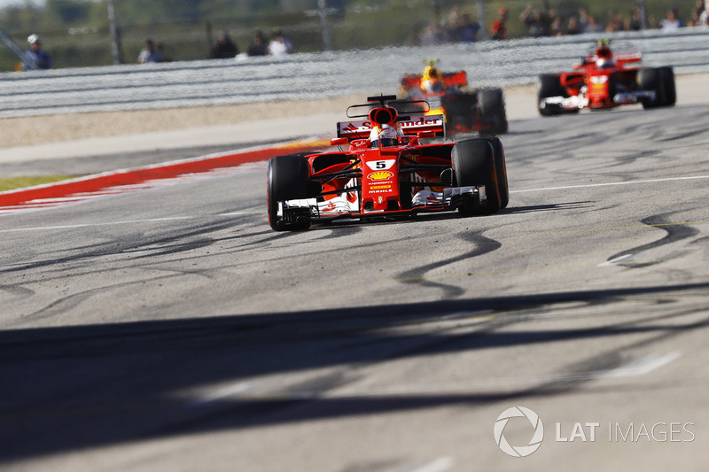 Sebastian Vettel, Ferrari SF70H, crosses the line ahead of Max Verstappen, Red Bull Racing RB13, Kim