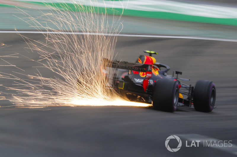 Sparks fly from the car of Max Verstappen, Red Bull Racing RB14 Tag Heuer