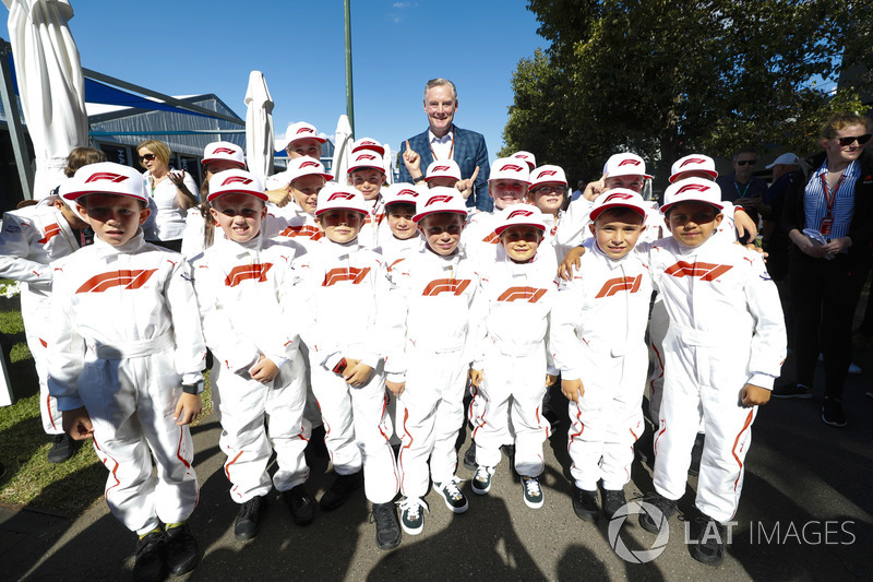 Sean Bratches, Managing Director of Commercial Operations, Formula One Group, poses with Grid Kids