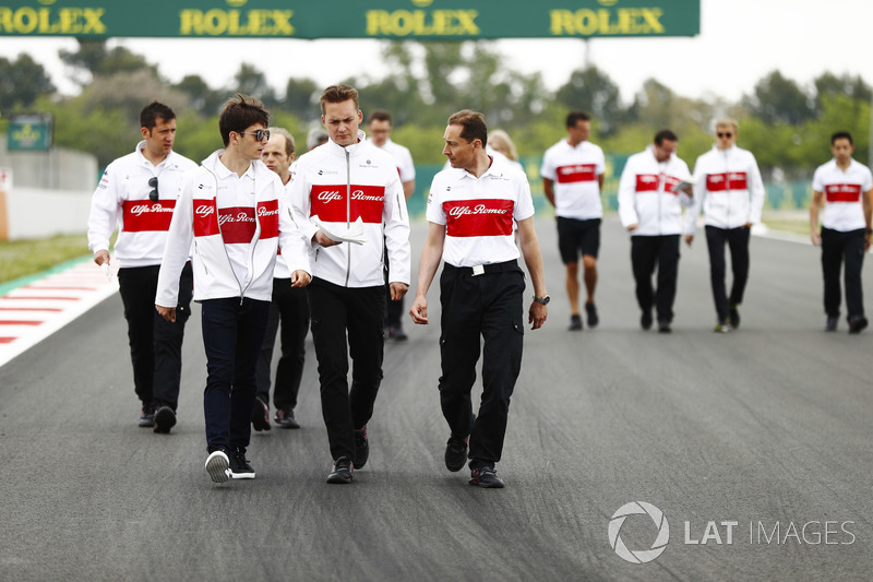 Charles Leclerc, Sauber, walks the circuit with colleagues, including Marcus Ericsson, Sauber