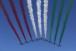 The Italian Ir Force Aerobatics team, Frecce Tricolri, overfly the grid in their Aermacchi MB-339 PA