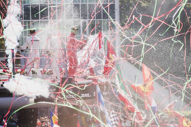 Second place Valtteri Bottas, Mercedes AMG F1, Race winner Third place Lewis Hamilton, Mercedes AMG F1 Sebastian Vettel, Ferrari, celebrate on the podium, Champagne