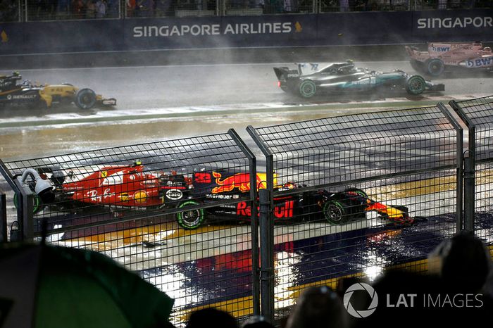 The cars of Kimi Raikkonen, Ferrari SF70H and Max Verstappen, Red Bull Racing RB13 crash and collide