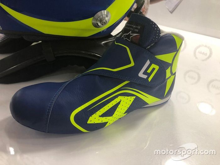 Boots of Lando Norris, McLaren with the colors of Valentino Rossi