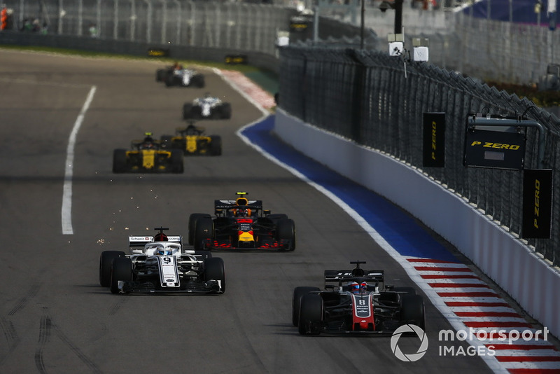 Romain Grosjean, Haas F1 Team VF-18 leads Marcus Ericsson, Sauber C37