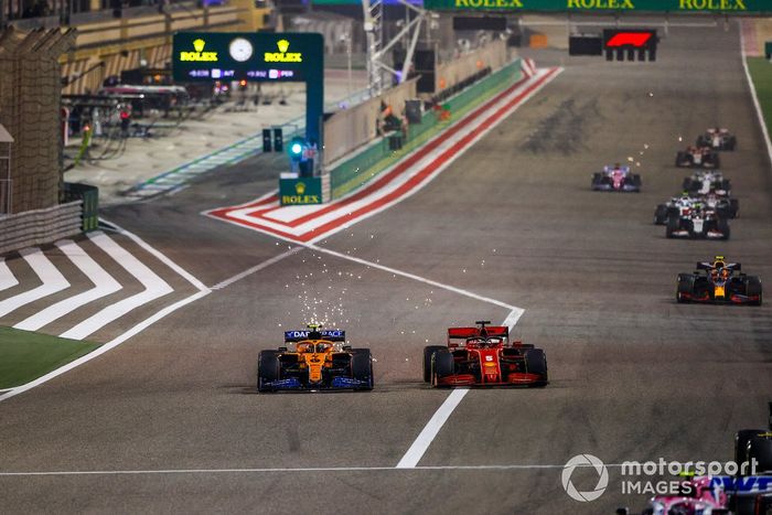 Lando Norris, McLaren MCL35, Sebastian Vettel, Ferrari SF1000