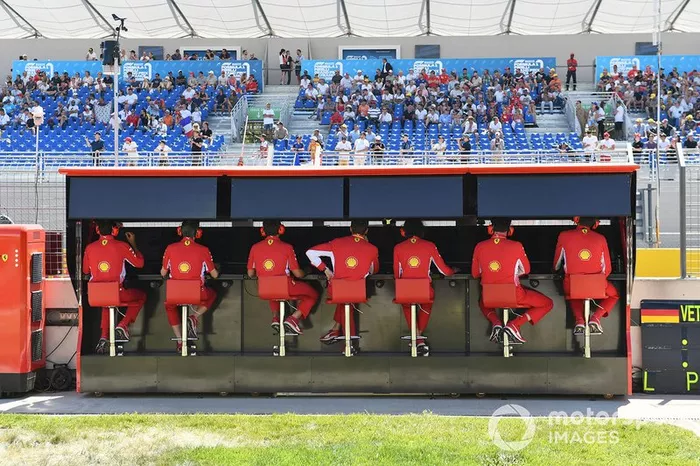 The Ferrari team on the pit wall