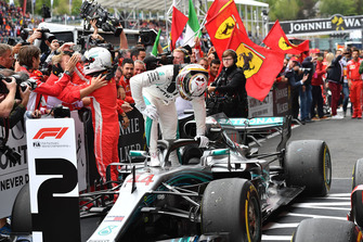 Sebastian Vettel, Ferrari and Lewis Hamilton, Mercedes AMG F1 W09 celebrate in parc ferme