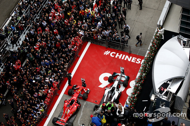 Lewis Hamilton, Mercedes AMG, sprays Champagne on the podium