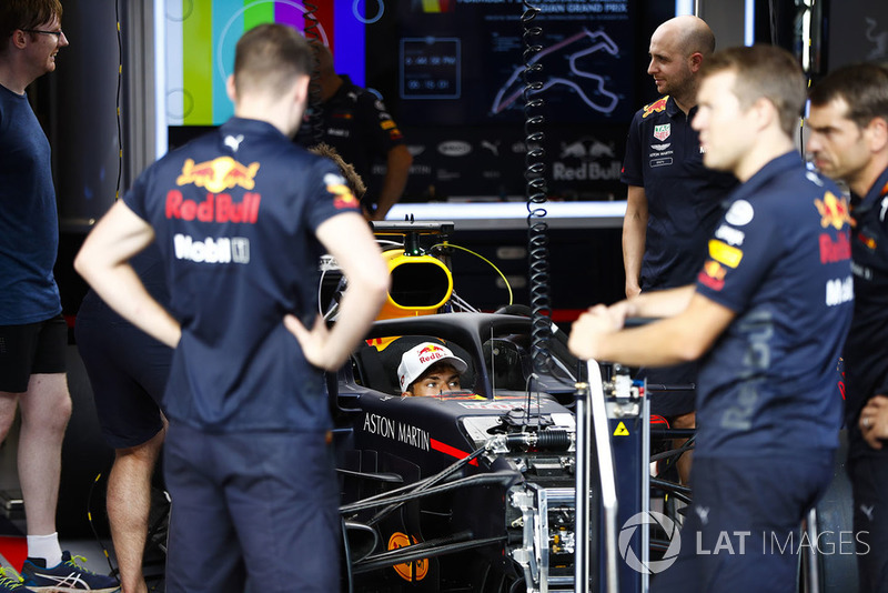 Pierre Gasly, Toro Rosso, sits in a Red Bull Racing RB14