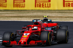 Sebastian Vettel, Ferrari SF71H, leads Valtteri Bottas, Mercedes AMG F1 W09
