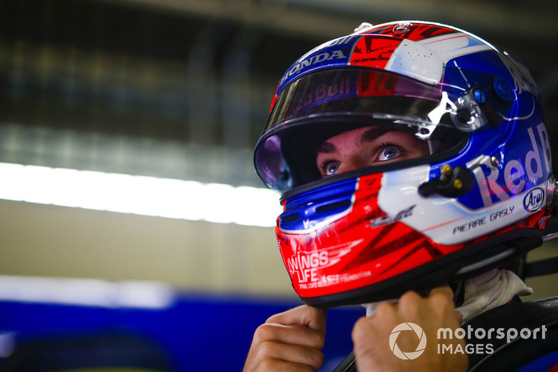 Pierre Gasly, Toro Rosso, adjusts his helmet