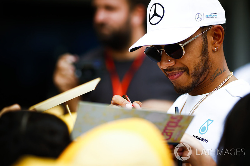 Lewis Hamilton, Mercedes AMG F1, signs autographs for fans