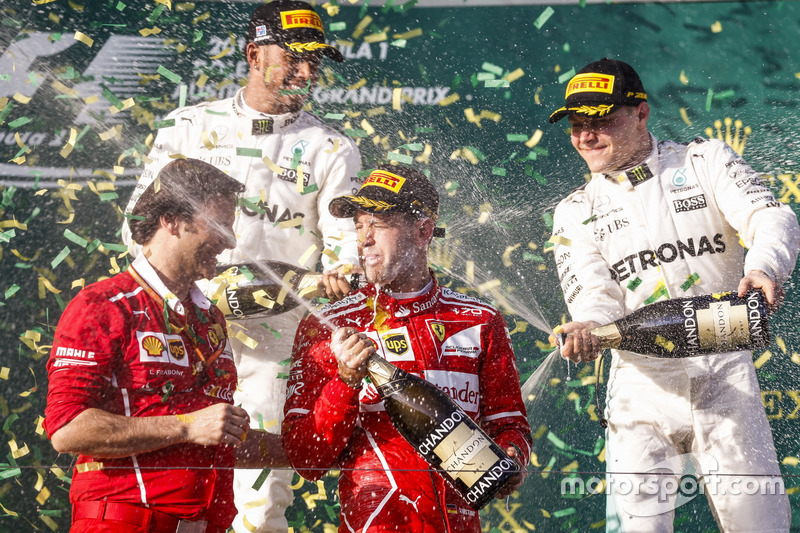 Sebastian Vettel, Ferrari, 1st Position, Lewis Hamilton, Mercedes AMG, 2nd Position, Valtteri Bottas, Mercedes AMG, 3rd Position, and Luigi Fraboni, Head of Power Unit Race Operation, Ferrari, celebrate with Champagne on the podium