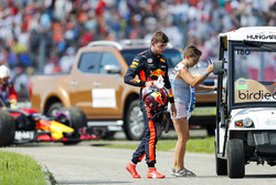 Max Verstappen, Red Bull Racing, gets a lift back to the pits after retiring from the race