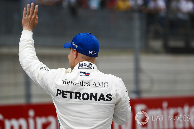 Pole sitter Valtteri Bottas, Mercedes AMG F1, waves to the fans