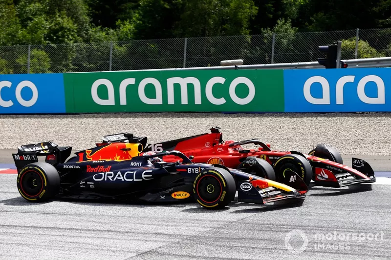 Max Verstappen, Red Bull Racing RB19, battles with Charles Leclerc, Ferrari SF-23