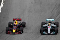 Max Verstappen, Red Bull Racing RB13, passes Lewis Hamilton, Mercedes AMG F1 W08, for the lead