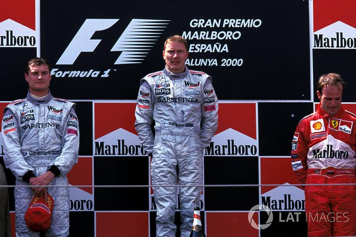 Podium: race winner Mika Hakkinen, McLaren, second place David Coulthard, McLaren, third place Ruben
