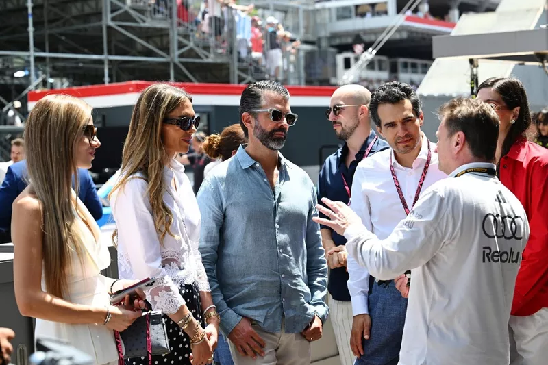 Allan McNish, Racing Director of Audi F1 Team talks to Donald Trump Jr and his wife Bettina Anderson