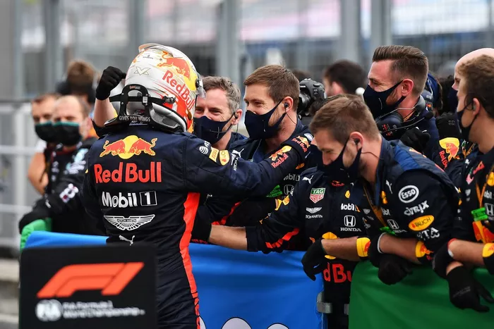 Max Verstappen, Red Bull Racing celebrates with team members in parc ferme