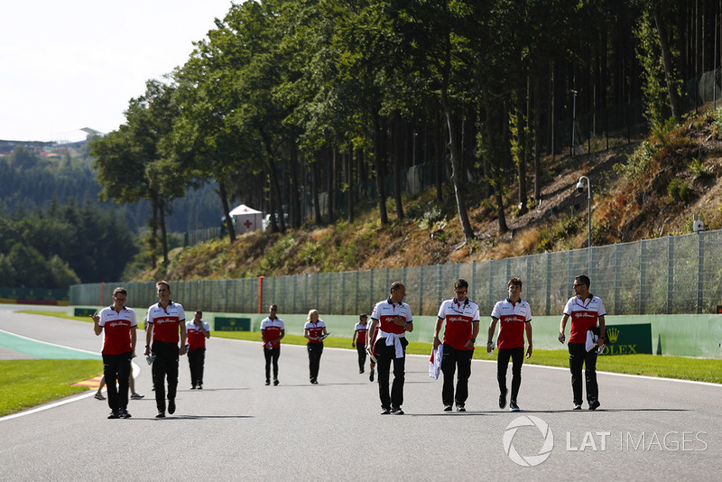 Charles Leclerc, Sauber, walks the circuit with colleagues