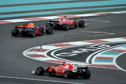 Kimi Raikkonen, Ferrari SF70H and Max Verstappen, Red Bull Racing RB13 battle with Sebastian Vettel,