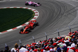 Kimi Raikkonen, Ferrari SF71H, leads Esteban Ocon, Force India VJM11