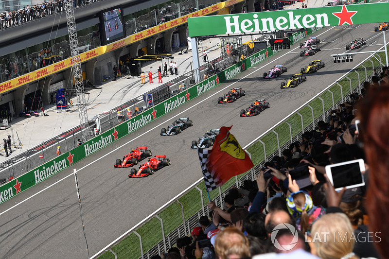 Sebastian Vettel, Ferrari SF71H leads Kimi Raikkonen, Ferrari SF71H at the start of the race