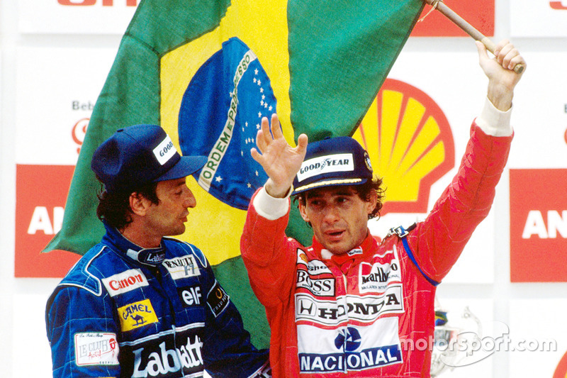 Podium: race winner Ayrton Senna, McLaren, second place Riccardo Patrese, Williams