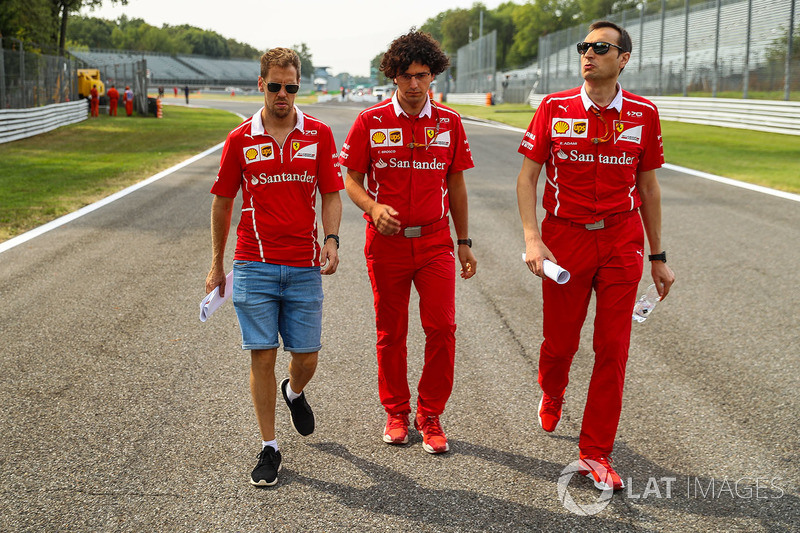 Sebastian Vettel, Ferrari and Riccardo Adami, Ferrari Race Engineer walk the track