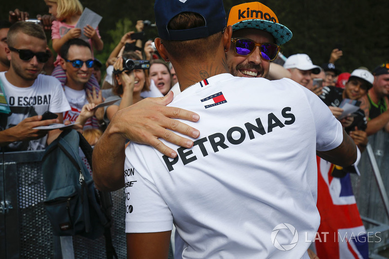 Fernando Alonso, McLaren, is greeted by Lewis Hamilton, Mercedes AMG F1