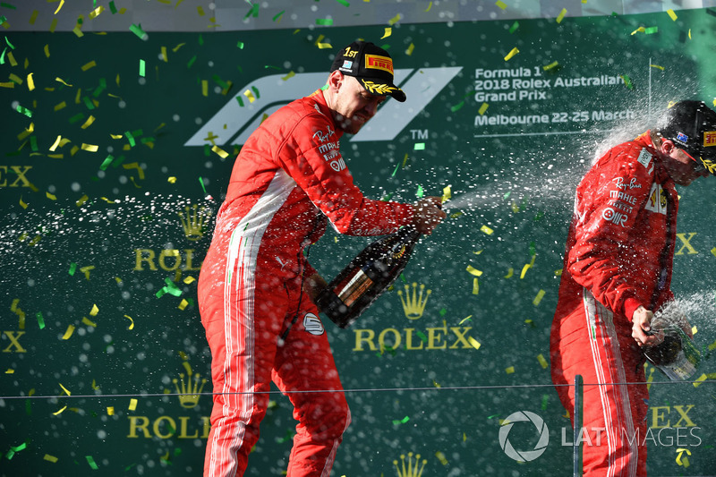 Race winner Sebastian Vettel, Ferrari and Kimi Raikkonen, Ferrari celebrate on the podium with the champagne