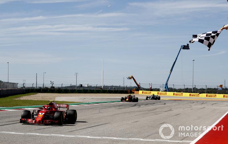 Kimi Raikkonen, Ferrari SF71H, 1st position, takes the chequered flag ahead of Max Verstappen, Red Bull Racing RB14, 2nd position, and Lewis Hamilton, Mercedes AMG F1 W09 EQ Power+, 3rd position