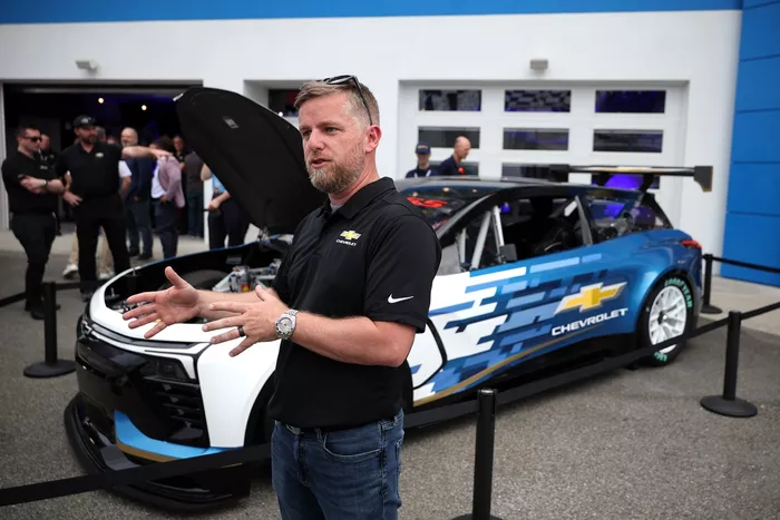 Justin Allgaier speaks during Chevrolet unveiling of the new Blazer EV.R NASCAR prototype
