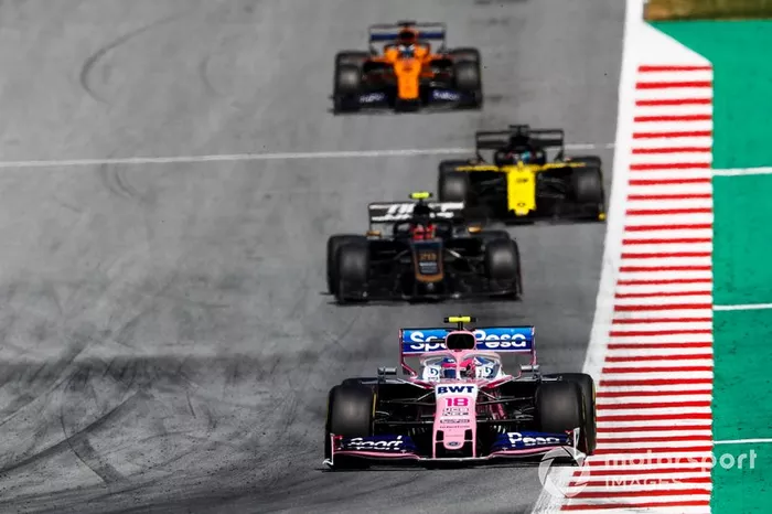 Lance Stroll, Racing Point RP19, leads Kevin Magnussen, Haas F1 Team VF-19, Daniel Ricciardo, Renault F1 Team R.S.19, and Carlos Sainz Jr., McLaren MCL34