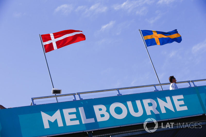 Danish and Swedish flags above a Melbourne sign