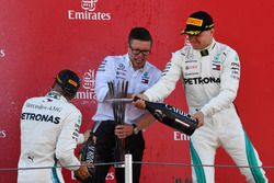 Bonnington, Mercedes AMG F1 Race Engineer, Valtteri Bottas, Mercedes-AMG F1 and Lewis Hamilton, Mercedes-AMG F1 celebrate on the podium with the champagne