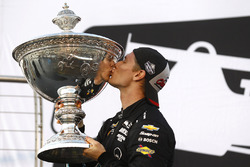 2017 champion Josef Newgarden, Team Penske Chevrolet celebrates by kissing the Astor Cup on the podium