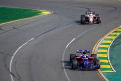 Daniil Kvyat, Scuderia Toro Rosso STR12, leads Sergio Perez, Force India VJM10