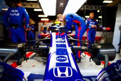 Engineers work on the car of Pierre Gasly, Toro Rosso STR13