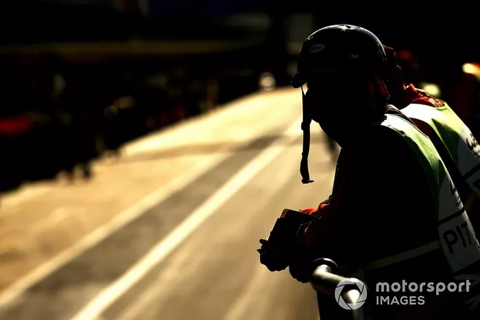 Marshals in the pit lane